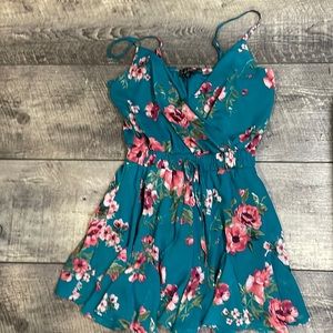 A green flower romper and is sized small